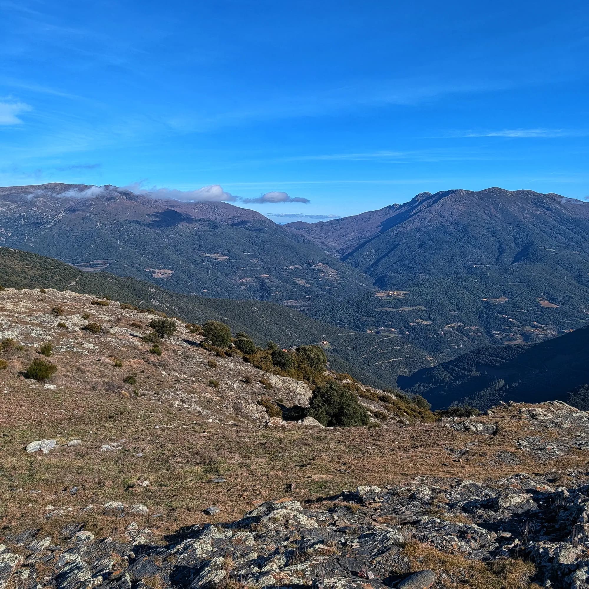 Panoramic view of Matagalls, Agudes, and Turó de l'Home mountains from the summit of Sui.