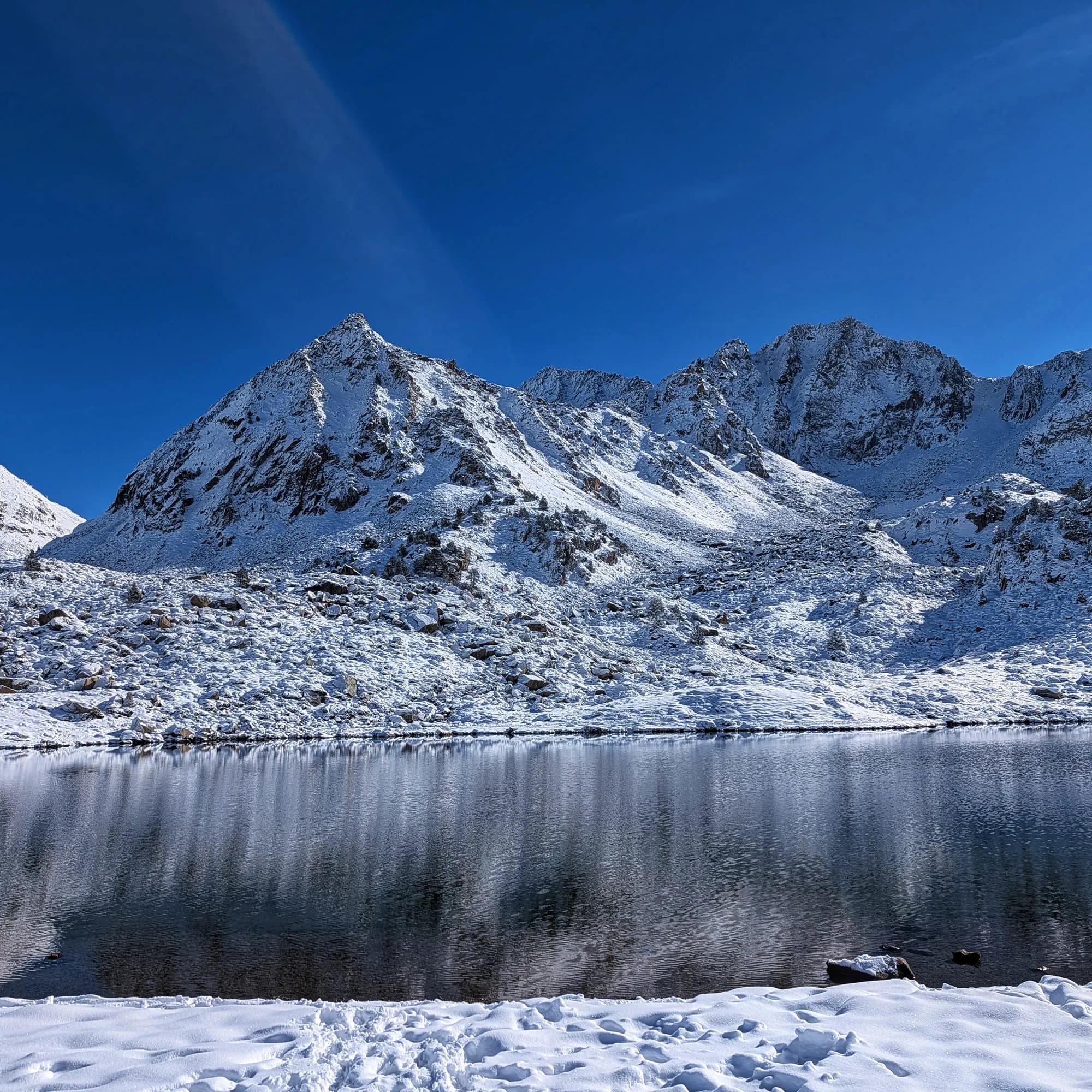 Estany de les Abelletes (Abelletes Lake) with fresh snow.