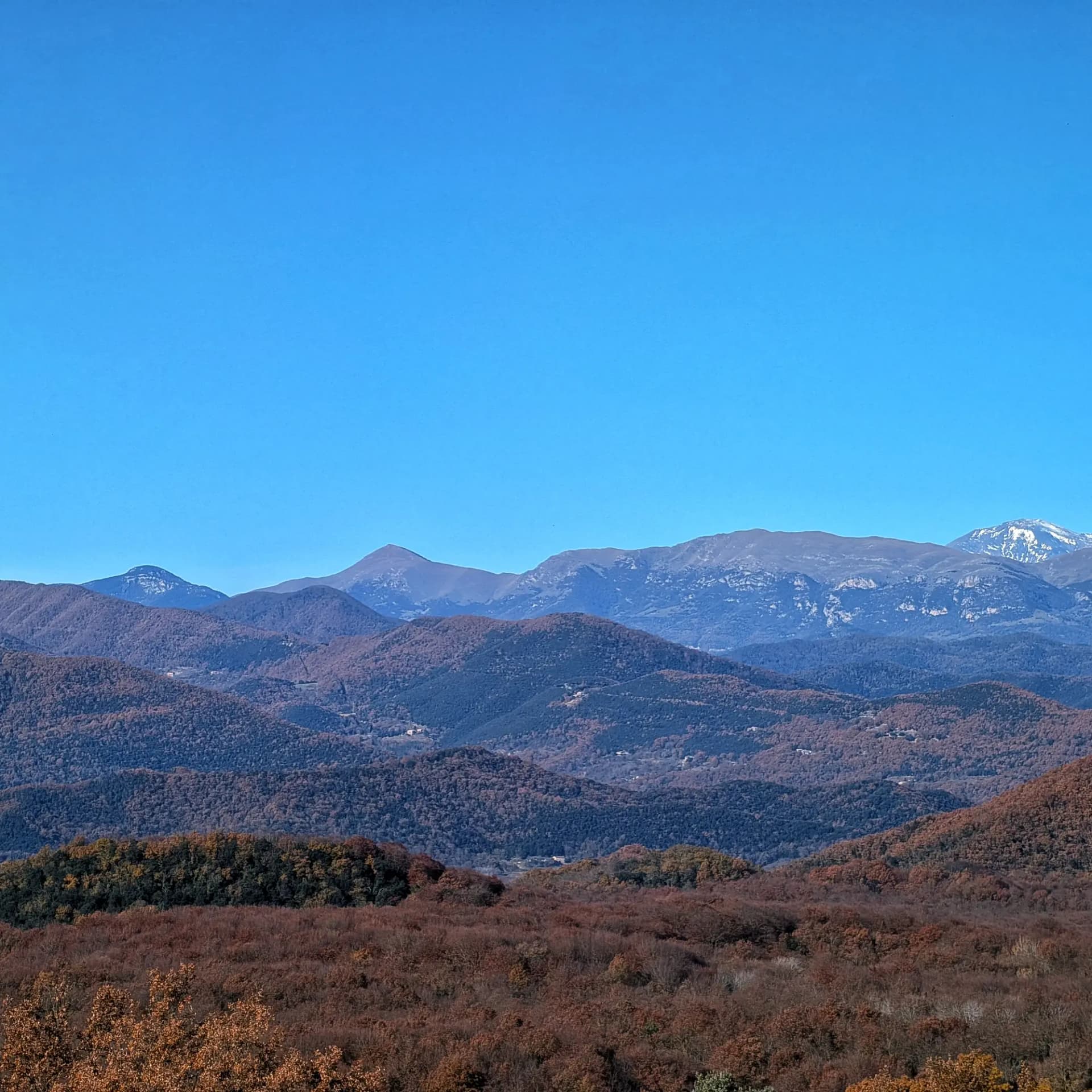 Mountains Puig de Sant Amand, Taga, Puig Estela, and snowy Puigmal viewed from Sacot Castle.