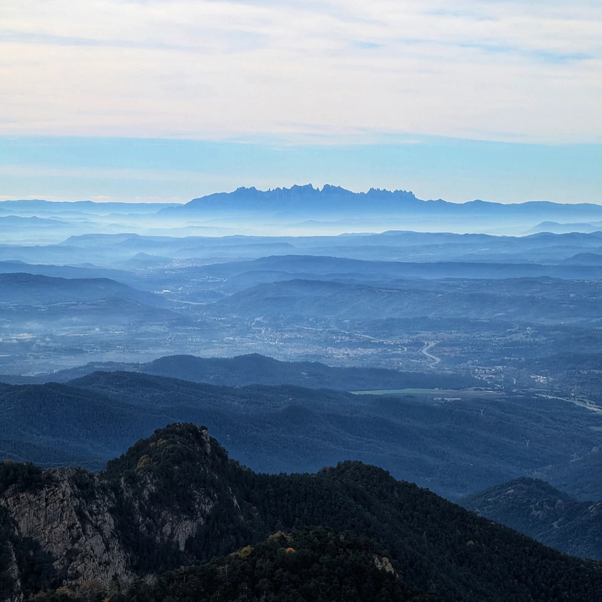 Distant views of the Montserrat mountain range from the summit.