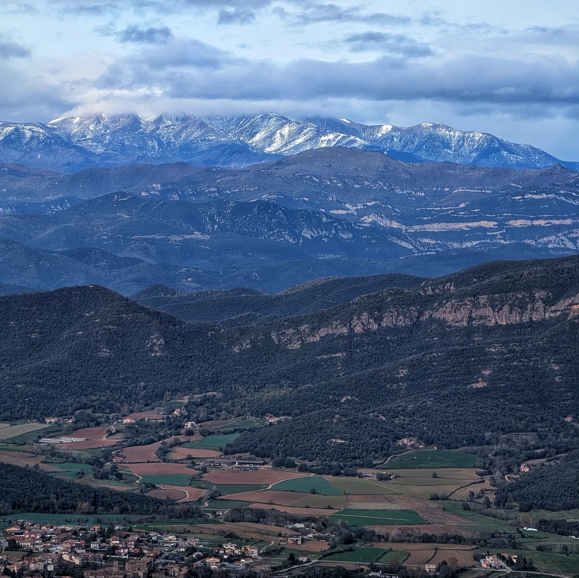 Views of the Canigó Massif from the Puigsallança summit with Santa Pau below. Views of the Canigó Massif from the Puigsallança summit with Santa Pau below.