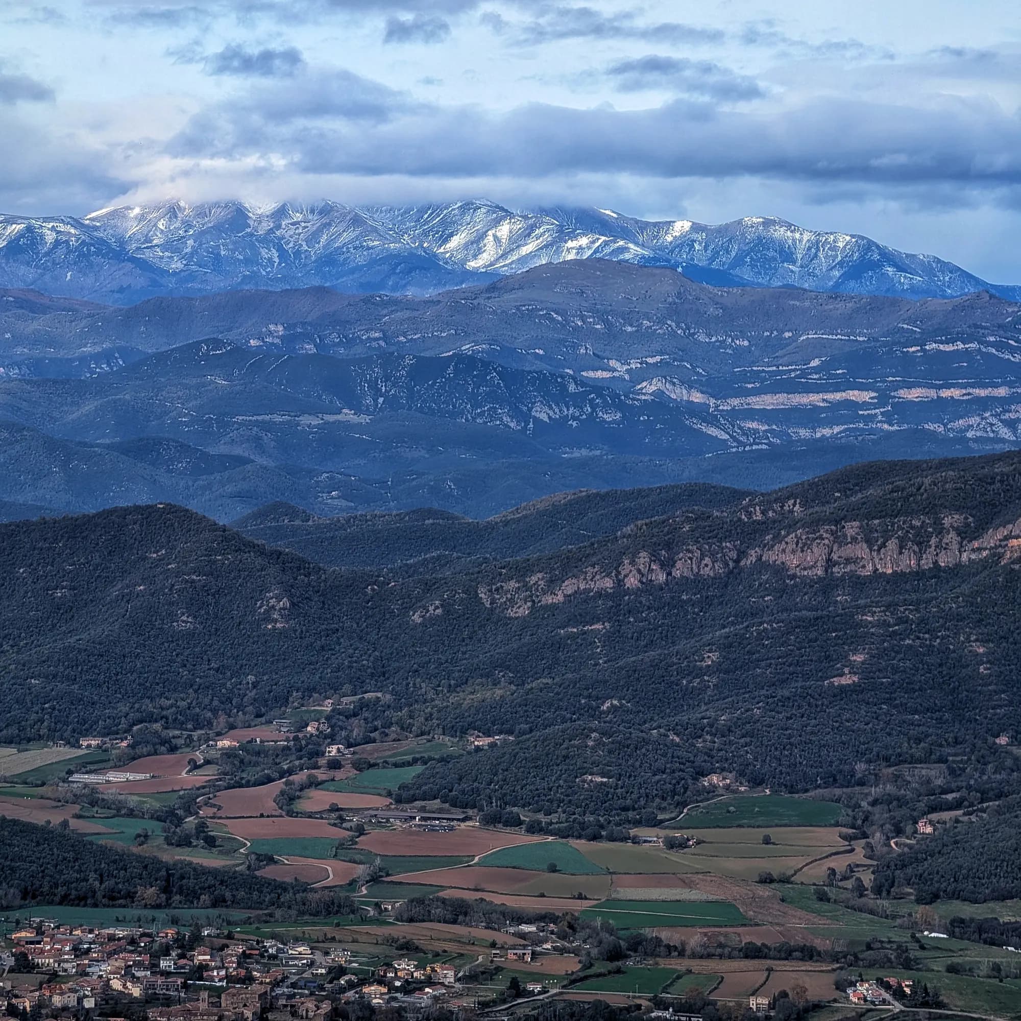 Views of the Canigó Massif from the Puigsallança summit with Santa Pau below. Views of the Canigó Massif from the Puigsallança summit with Santa Pau below.