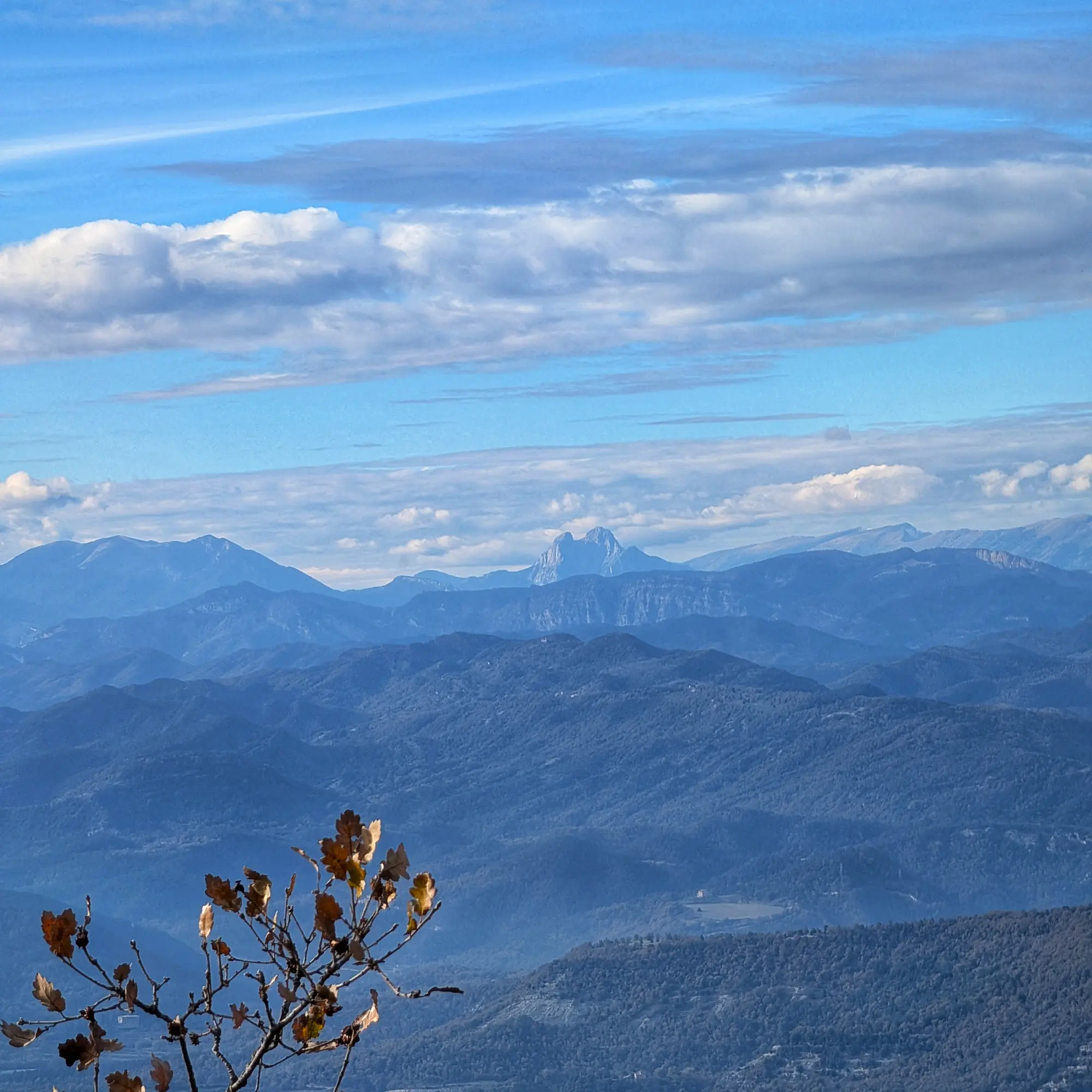Panoramic view from Bellmunt, featuring the Serra d'Ensija on the left, the majestic Pedraforca in the center, and the Cadí mountain range on the right. Serra d'Ensija (left), Pedraforca (center), and Cadí mountain range (right) from Bellmunt.