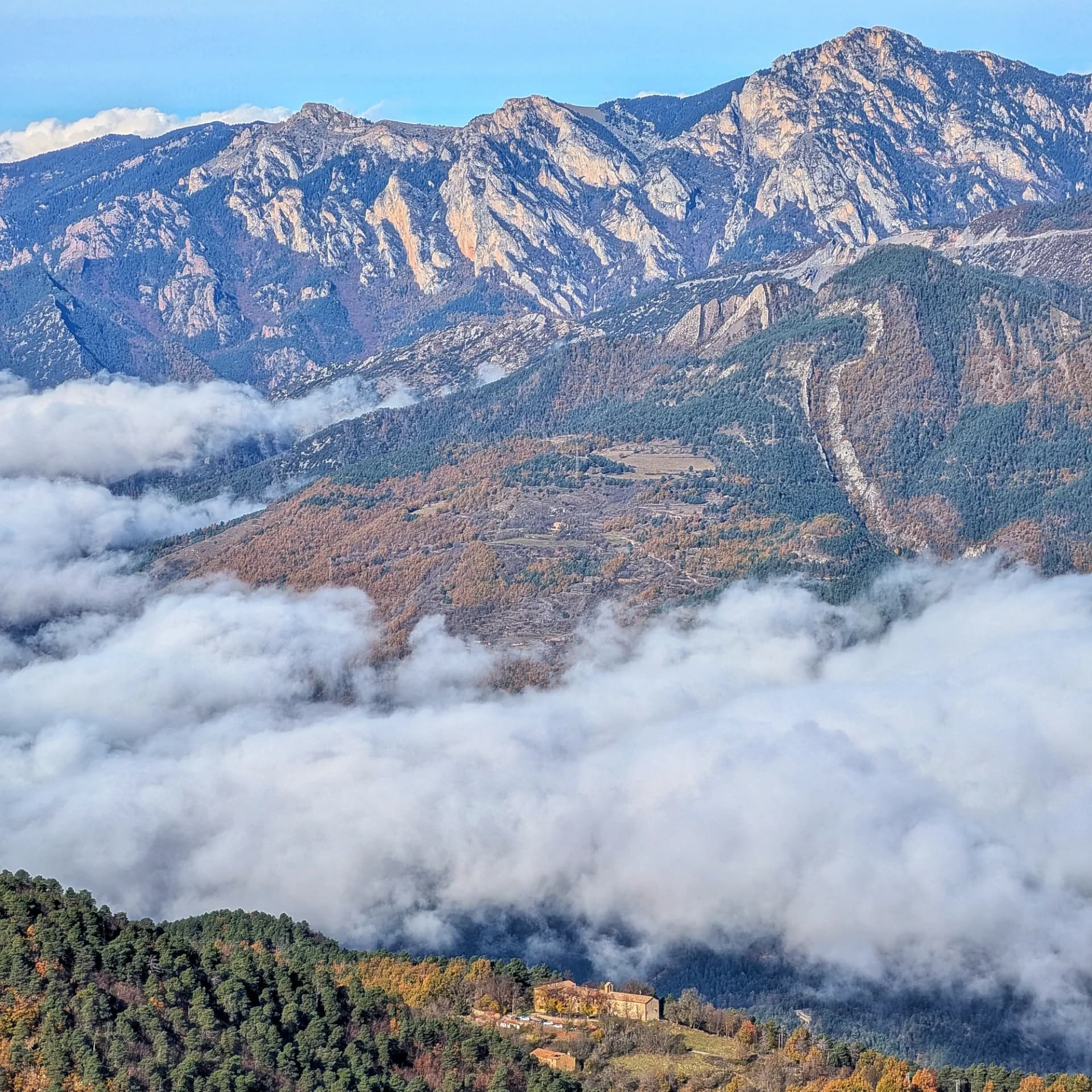 Santuari de Falgars, Penyes Altes and Moixeró from the Roca del Joc (Roca de la Devesa Jussana) Peak Santuari de Falgars, Penyes Altes and Moixeró from the Roca del Joc (Roca de la Devesa Jussana) Peak