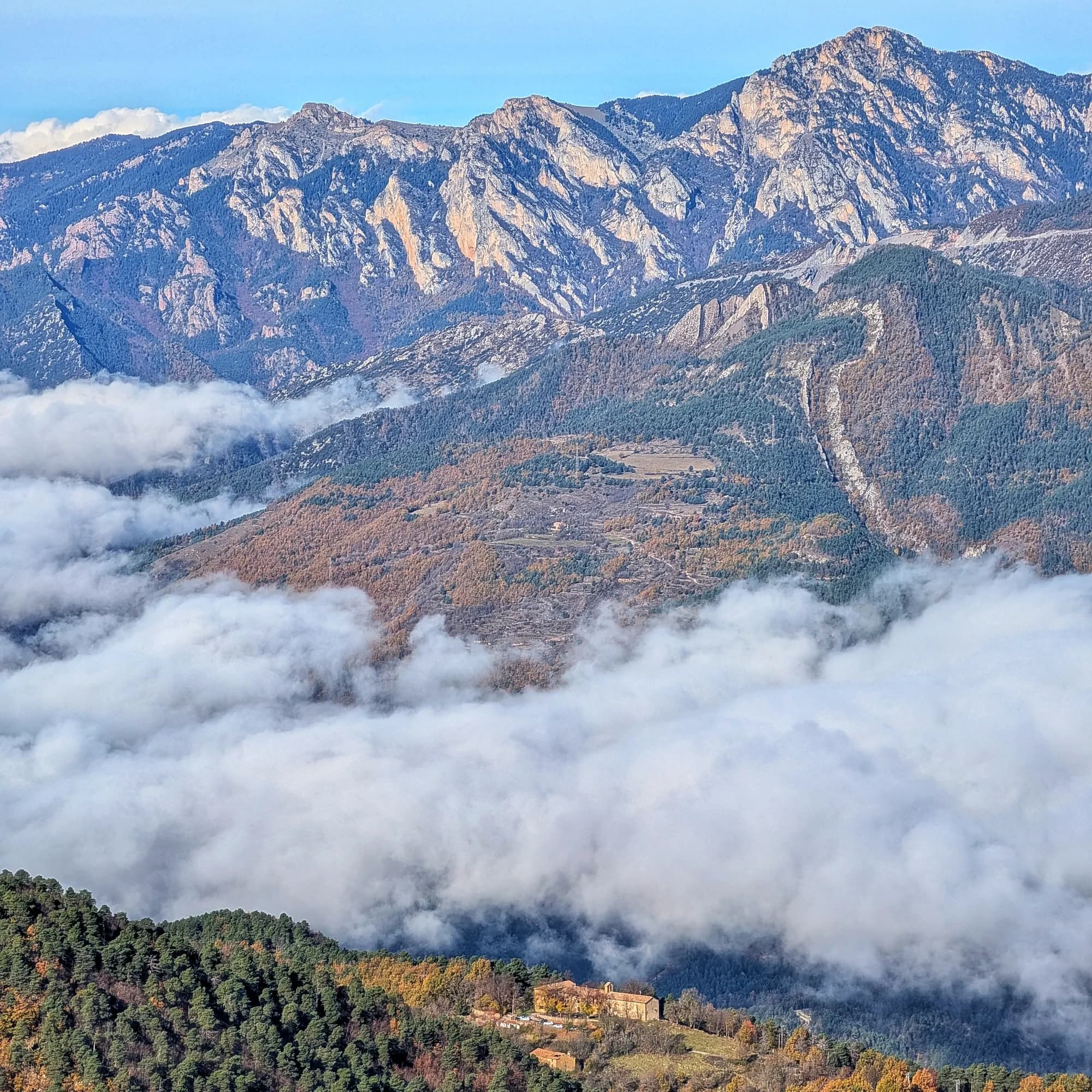 Santuari de Falgars, Penyes Altes and Moixer贸 from the Roca del Joc (Roca de la Devesa Jussana) Peak Santuari de Falgars, Penyes Altes and Moixer贸 from the Roca del Joc (Roca de la Devesa Jussana) Peak
