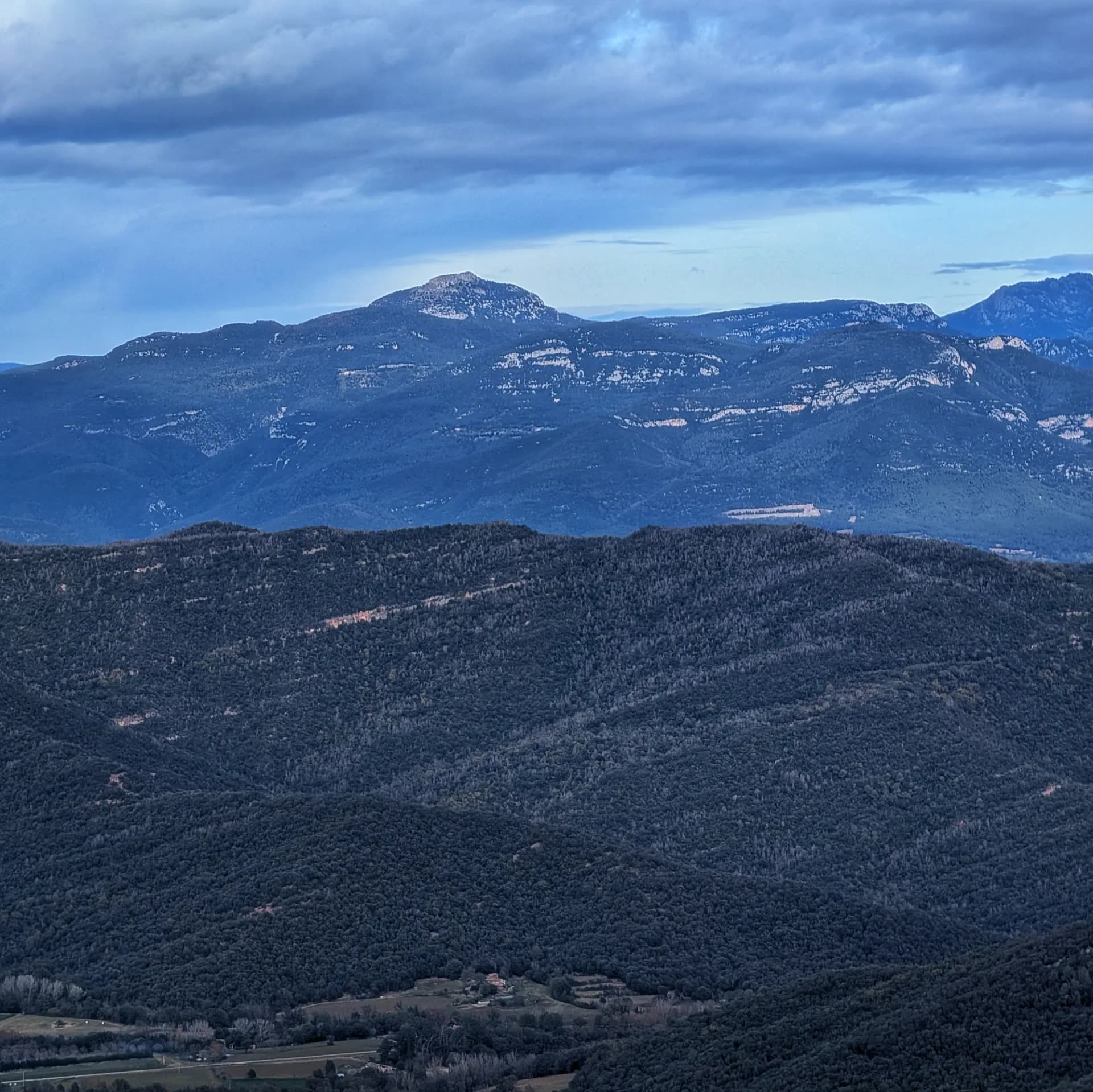 Views of Puig de Bassegoda from the Puigsallança summit Views of Puig de Bassegoda from the Puigsallança summit, with the Pyrenees in the background.