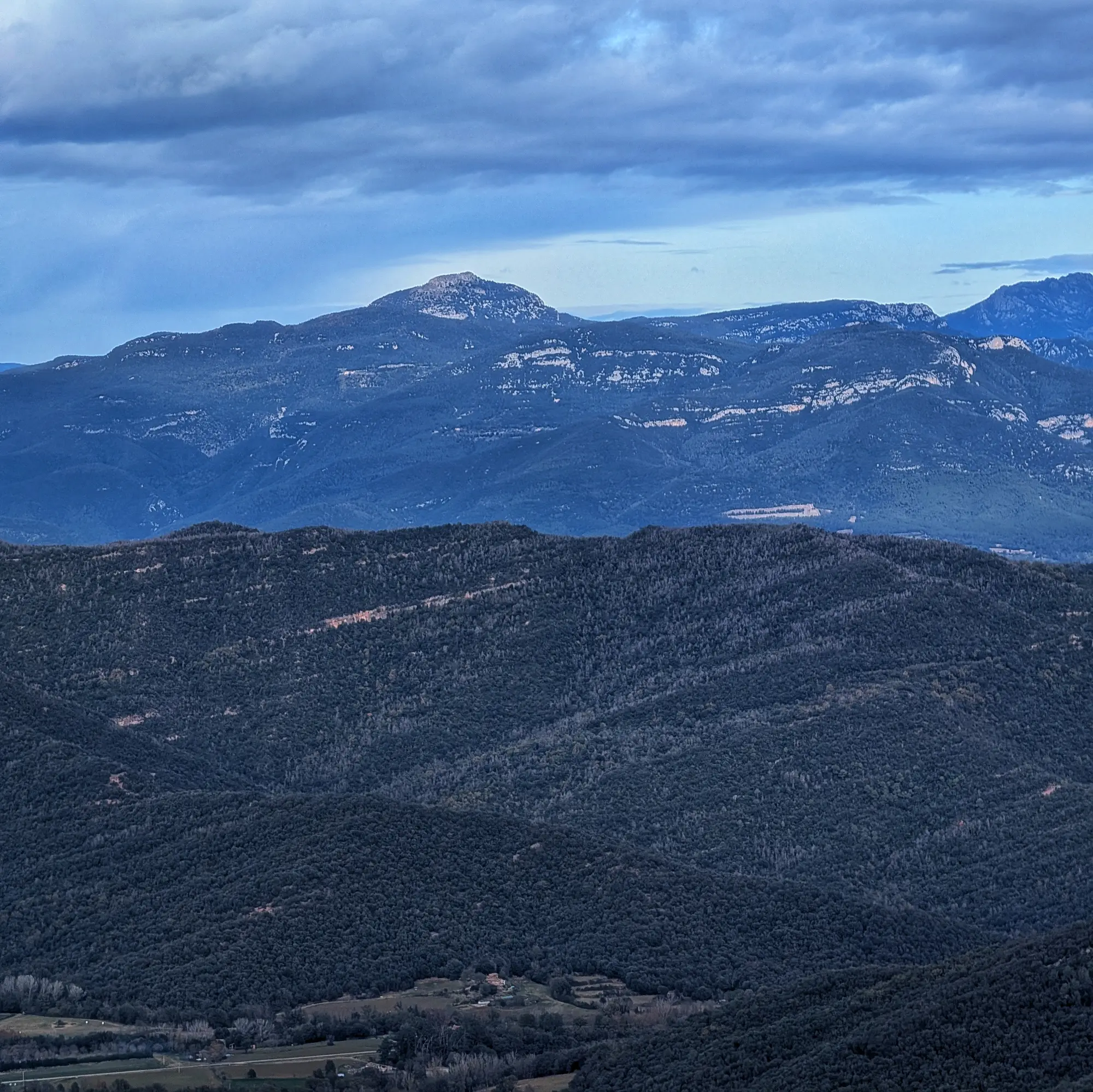 Views of Puig de Bassegoda from the Puigsallança summit Views of Puig de Bassegoda from the Puigsallança summit, with the Pyrenees in the background.